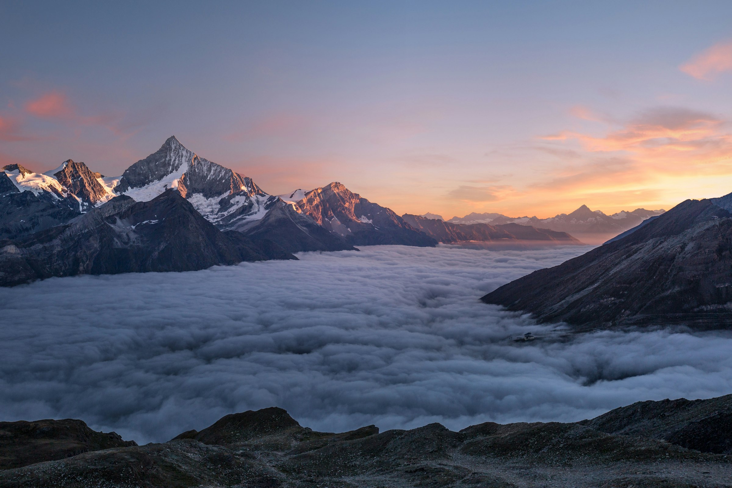 Mountain landscape above clouds at sunset, sample photograph used to demonstrate compression